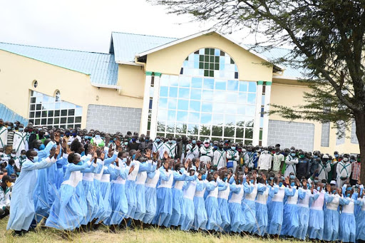 Youths sing a chorus during the celebrations