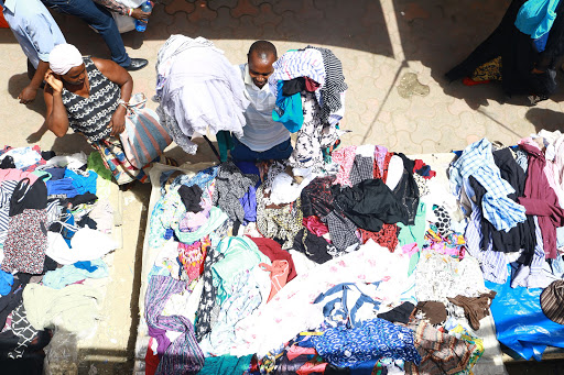 Mitumba (second-hand clothes) traders at Kongowea market despite Mombasa county's order to close the market. 