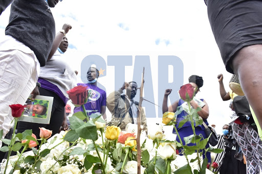 Feminist for Peace,Rights and Justice Center Kibera lead by Editar Ochieng sing and and chant around the grave of the late lgbt activist Kawira Mwirichia during her burial at Lang'ata cemetery on November 10,2020/ MERCY MUMO