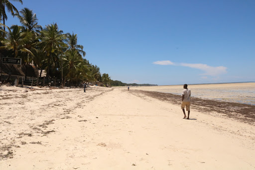 A man take a stroll along the pirates beach in Mombasa county,many beaches have remain deserted following the Corona virus pandemic.