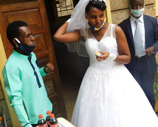 Newlyweds Godfrey Mutwiri and Grace Nkatha share an egg. 