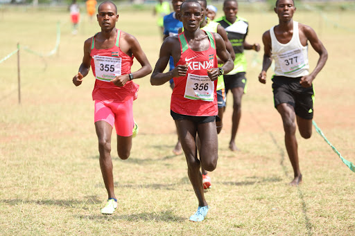 Ronald Mutai (355) and Bernard Bii (356) battle it out in the junior men's 8km race