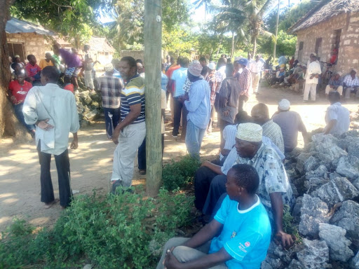 Family and friends of Hamisi Mwadunguda gather at his home in Kwale.