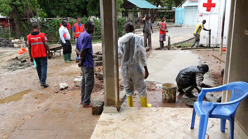 Workers setting up pathways to ease movement of bodies at the mobile Morgue that was installed by the Kenya Red Cross Society to aid in storing the 108 bodies at the Malindi Sub County Hospital mortuary