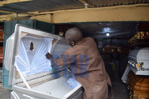 Joshua Oduor, working on a coffin at his shop  in Huruma estate on February 2, 2022