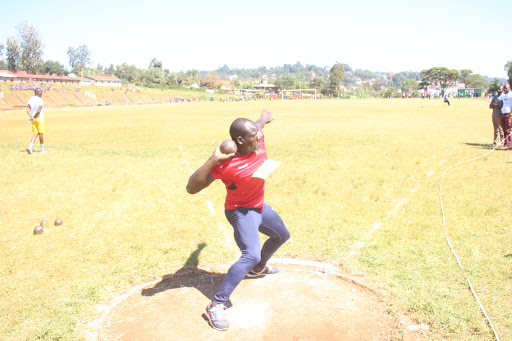 Calvince Omondi throws a shot put during Nyanza South pre trials at Kisii University 