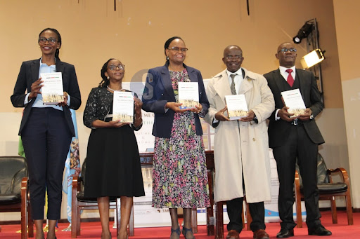 Nairobi LSK council member Njoki Mboce, Faculty of Law Dean Winfred Kamau, Chief Justice Martha Koome, UoN Faculty of Arts and Social Sciences Dean Jack Odhiambo and Canon Dr Wamuti Ndegwa hold a copy of 'The Supreme Court Settles the Law' book during its launch at the University of Nairobi School of law on November 15, 2023.