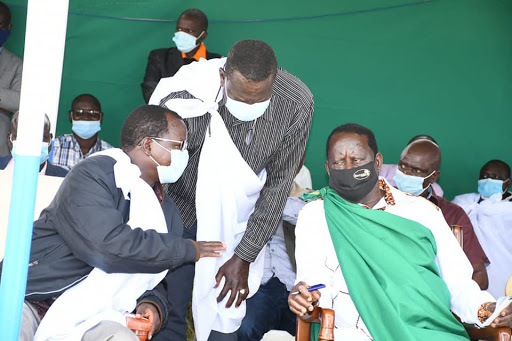 West Pokot Governor John Lonyangapuo, Senator Samuel Poghisio and ODM leader Raila Odinga talk in Tamugh in March