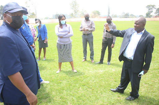 Kakamega County Sports Minister Kassim Were explains a point to World U20 LOC and other members who visited Bikhungu Stadium 