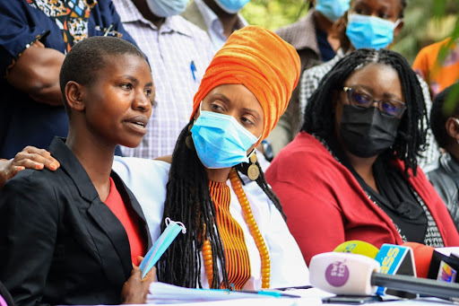 Janet Moraa(C) daughter of the late Jemimah Nyang'ate among the victims lynched on allegations of witchcraft speaks, flanked by Interfaith Religious Council of Kenya Executive Board member Bishop John Warari(L) and Kerubo Abuya(R) at Mayfair Hotel Nairobi on Thursday October 21, 2021.