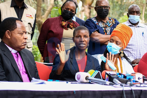 Janet Moraa(C) daughter of the late Jemimah Nyang'ate among the victims lynched on allegations of witchcraft speaks, flanked by Interfaith Religious Council of Kenya Executive Board member Bishop John Warari(L) and Kerubo Abuya(R) at Mayfair Hotel Nairobi on Thursday October 21, 2021.