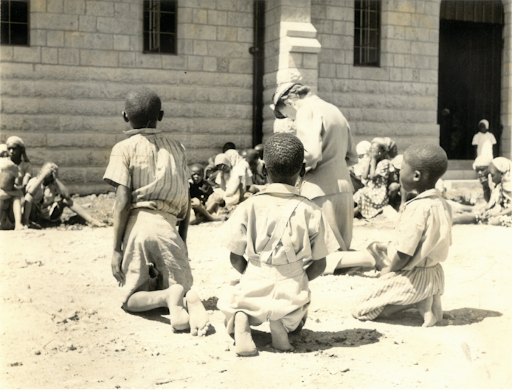 Children praying outside during the consecration of St Stephen's in 1953