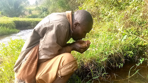 Suleiman Nyaga quenches his thirst with the mineral, salty waters of Gogo springs in Mukuuri Location, Embu County. He walks about 4km from his Kathande village twice a month to drink the mineral waters that he credits for his strong, healthy body.