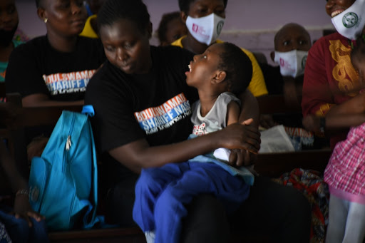 A mother with her child during an event to mark the World Cerebral Palsy Day in Mombasa on Tuesday. 