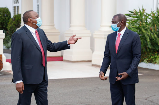 President Uhuru Kenyatta greets Deputy President Dr. William Ruto shortly before the 57th Madaraka Day Celebrations at State House, Nairobi.