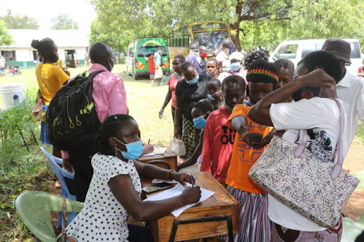 Residents register at Sigor before getting services during the free medical camp.