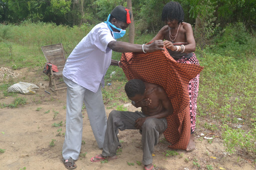 Tsuma Nzai, the Magarini cultural centre director, demonstrates how they used to treat Kivuti, a disease with similar symptoms of Covid-19 on April 26, 2020.