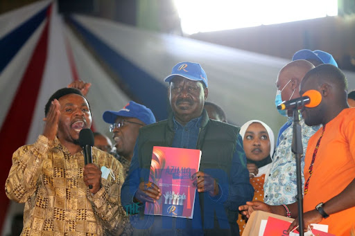 ODM leader Raila Odinga flanked with CAS Zack Kinutha receives the youth agenda document during his birthday party at Bomas of Kenya on January 7, 2022. 