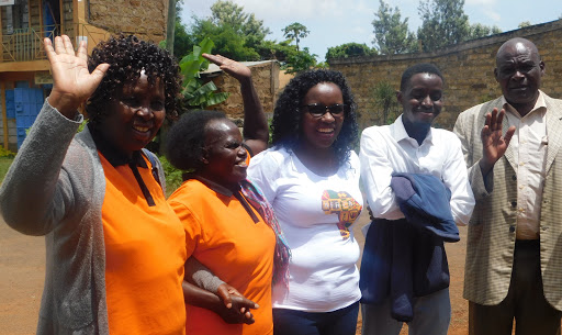 Widow Christine Nkuene, her sister in law, daughter in law and her son celebrate at the Kirindine law courts after they were acquitted of a criminal case relating to land ownership