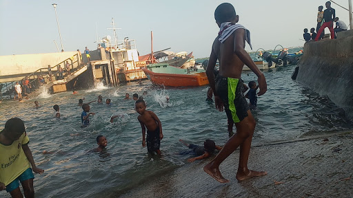 Children swimming on the shores of the Indian Ocean in Lamu.