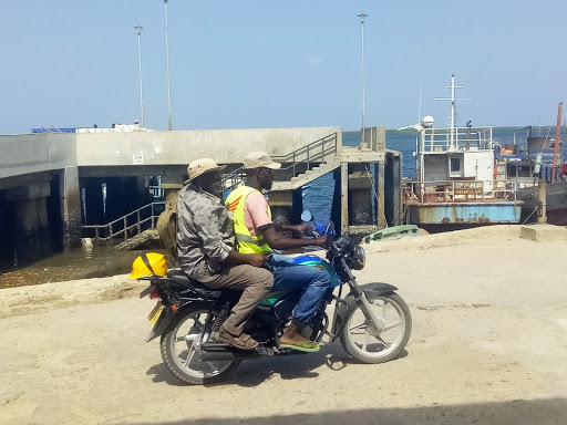 A boda boda operators ferries a passenger in Lamu town.